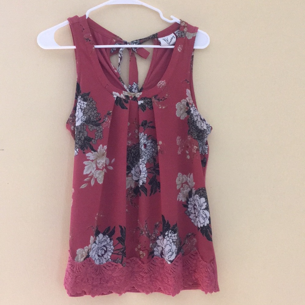 Pink tank top with white flowers.